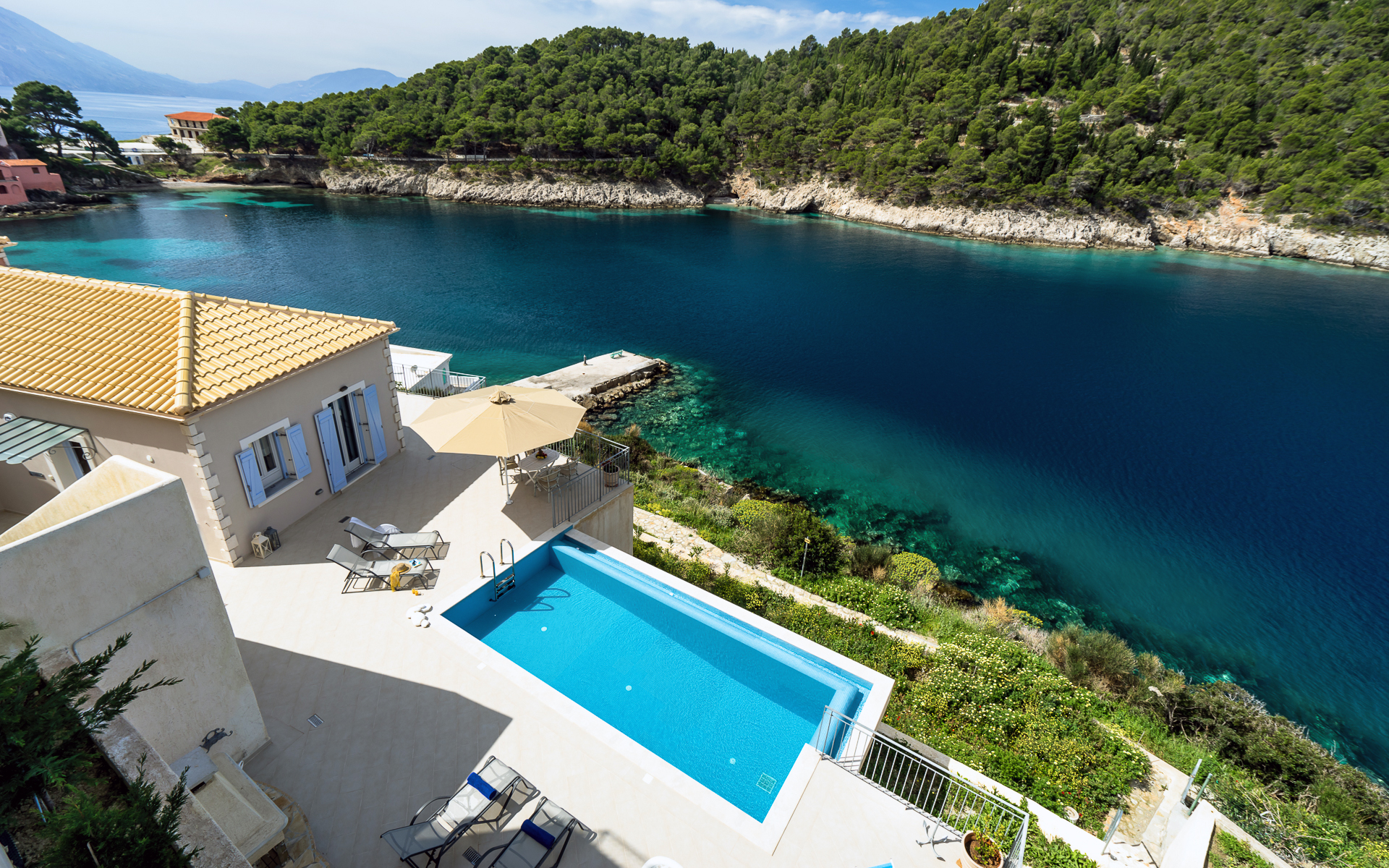 Greek Island Retreats - Hero Image - Image of villa with view over looking coastline