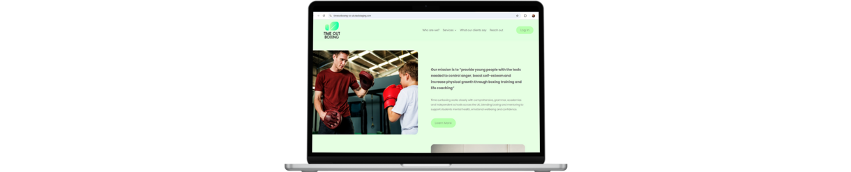 Timeout - Laptop with image of old website showing a kid and adult sparring