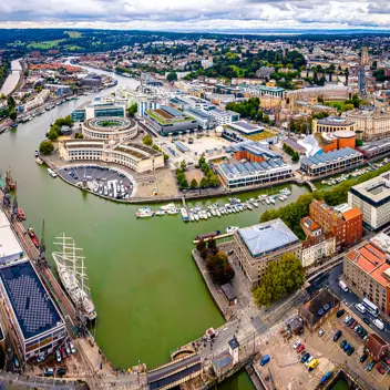 Roxburgh - An arial drone image of Bristol harbourside docks with the focal point on Roxburgh Milkins offices