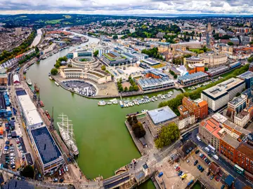 Roxburgh - An arial drone image of Bristol harbourside docks with the focal point on Roxburgh Milkins offices